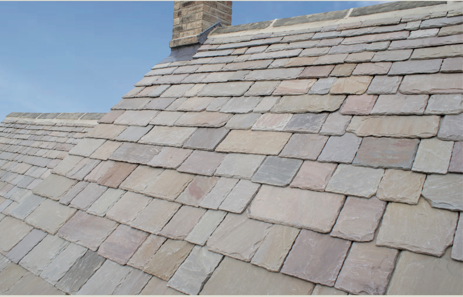 Cotswold roof laid in random diminishing courses of natural stone