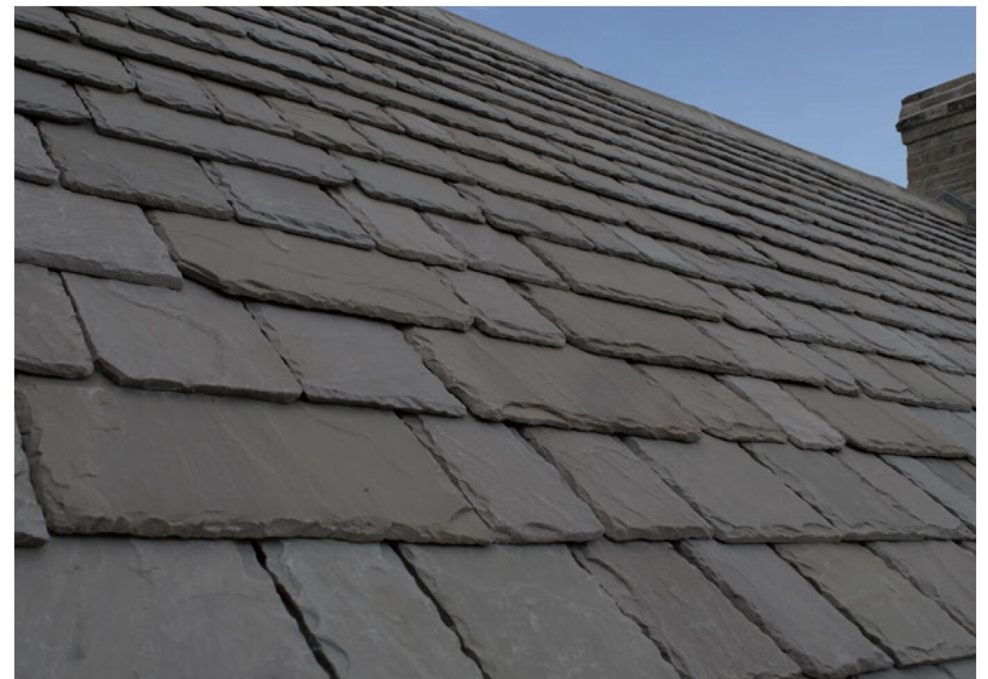 Cotslay Aged natural roof stone on a pitched Cotswold roof